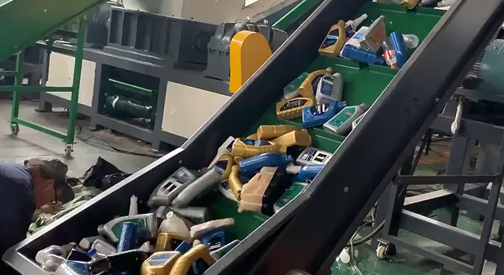 Real image of plastic waste being processed in recycling machine
